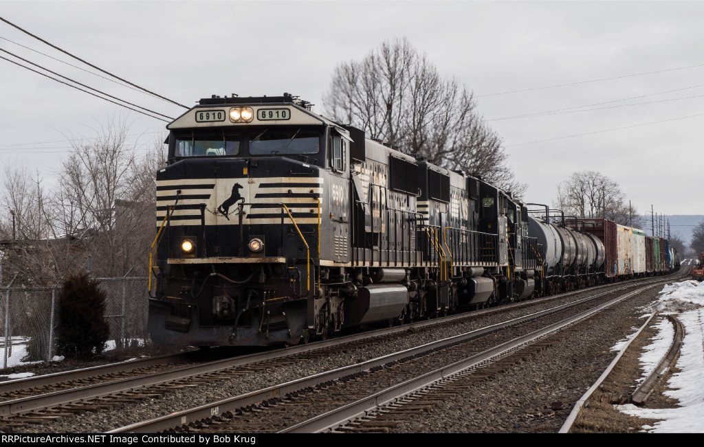 NS 6910 leads short manifest freight of cars headed to the C&F secondary